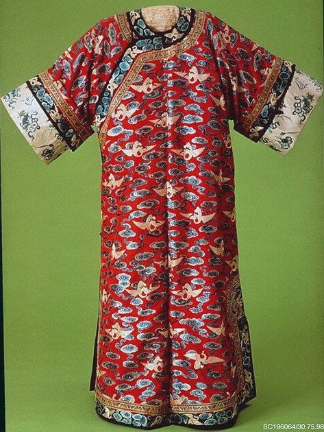 Woman’s robe decorated with cranes amid clouds