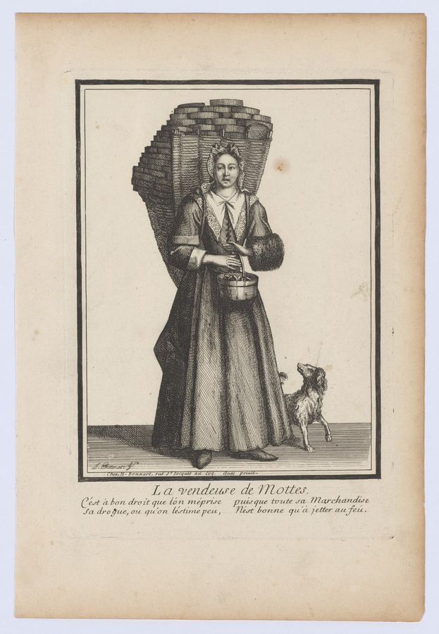 Woman selling turfs of peat